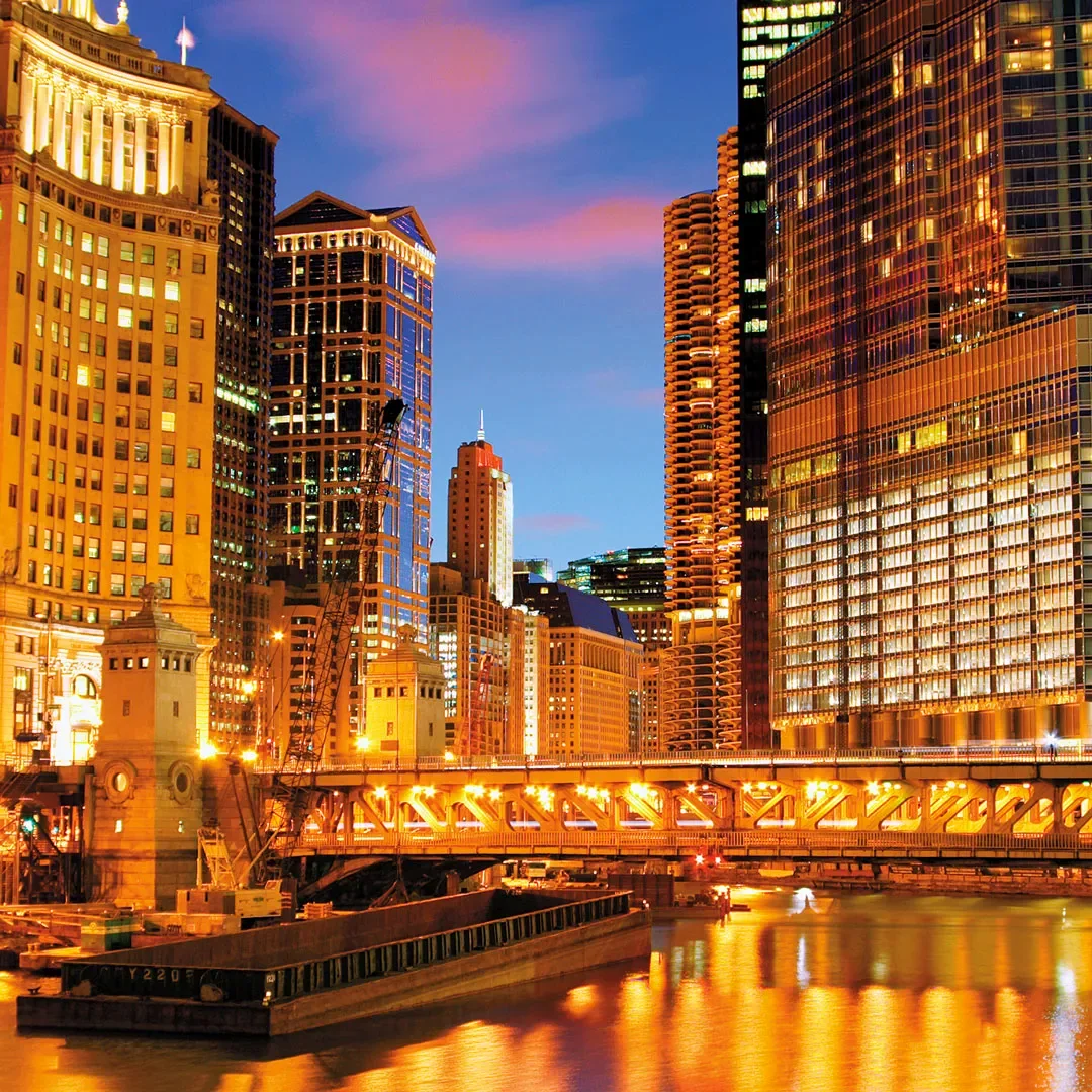 Chicago River and DuSable Bridge at dusk with the Wrigley Building and Marina City