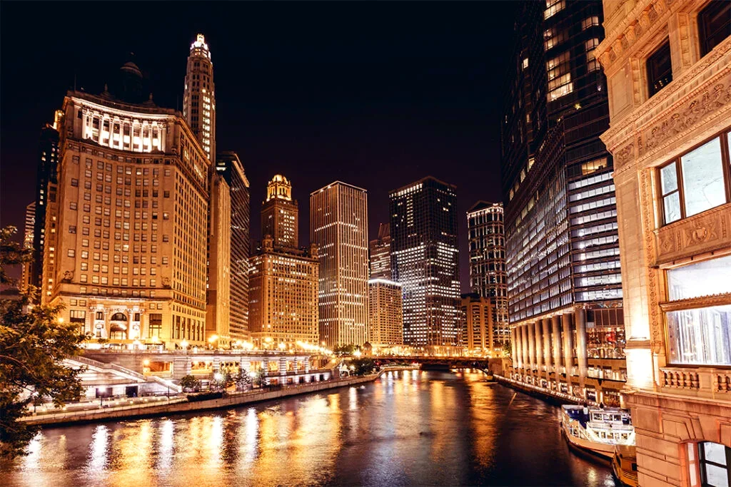 River North Chicago glowing at night above the Chicago River